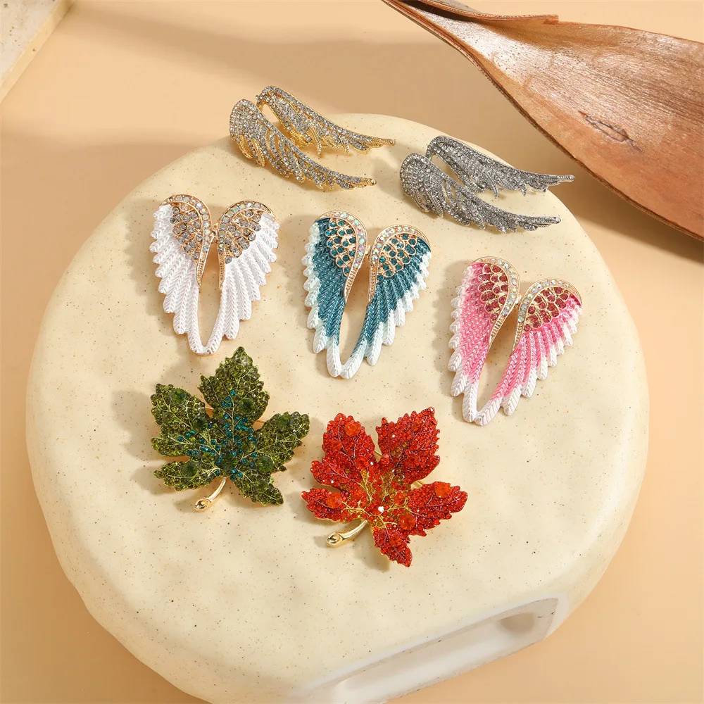 European and American new diamond studded angel wing brooch, niche trend feather alloy design, simple and light luxury chest