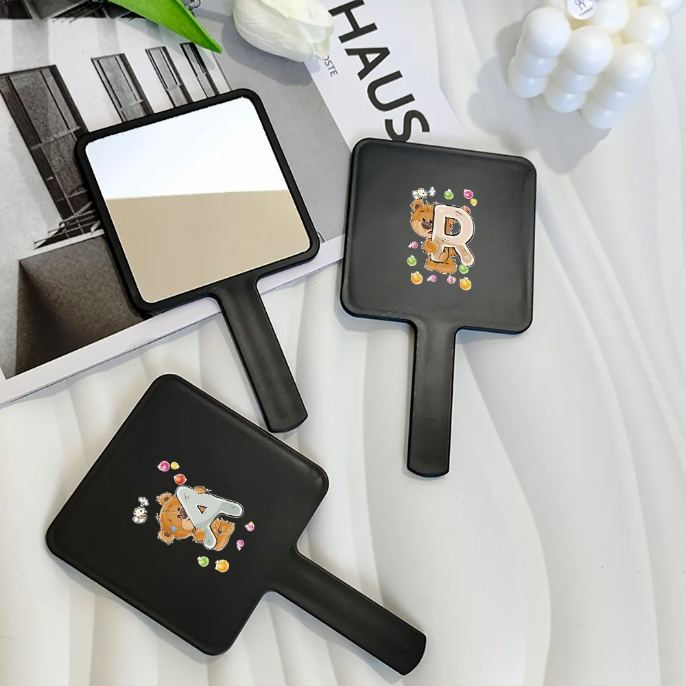 

1pc Fashion Handheld Makeup Mirror With Grip Handle Compact Portable Square Handle Mirror Initial Name Bear 26 Letters Pattern