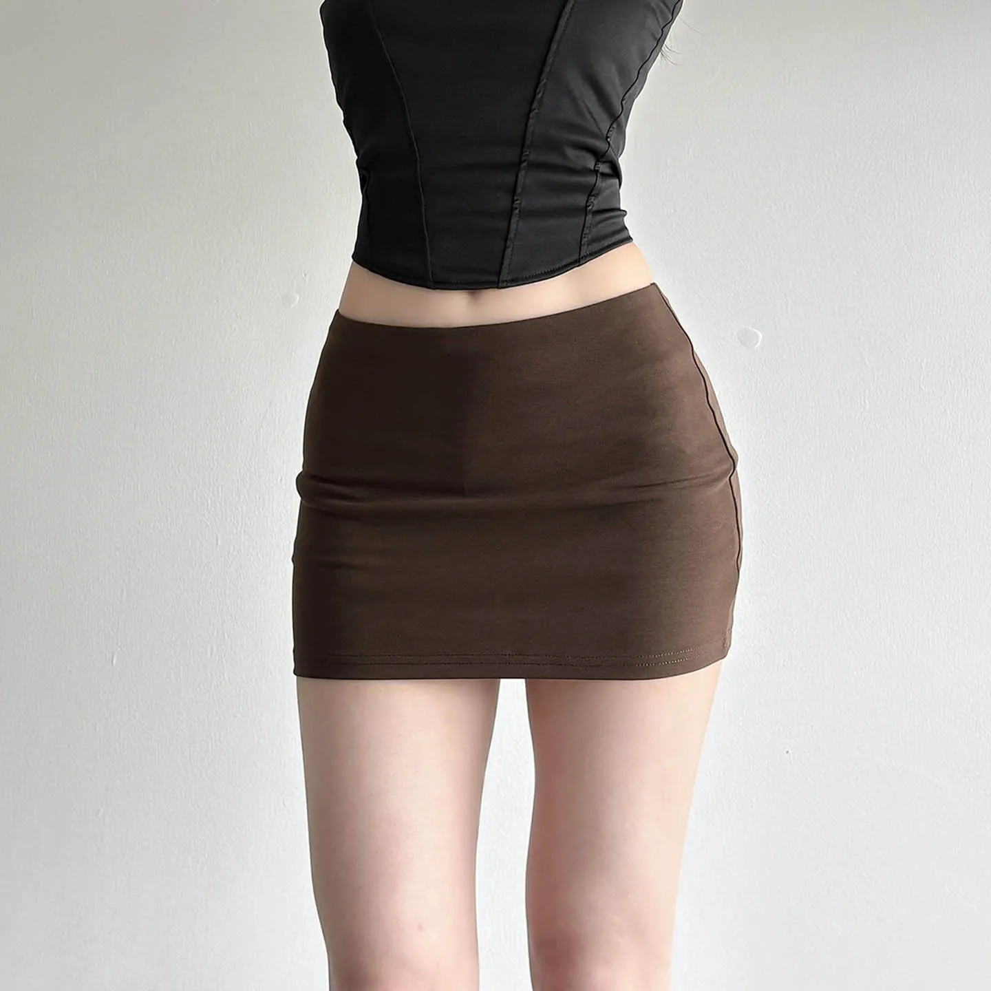 American spice girl wind solid color foundation one-piece low-waisted skirt with lining anti-exposure slim hip skirt female