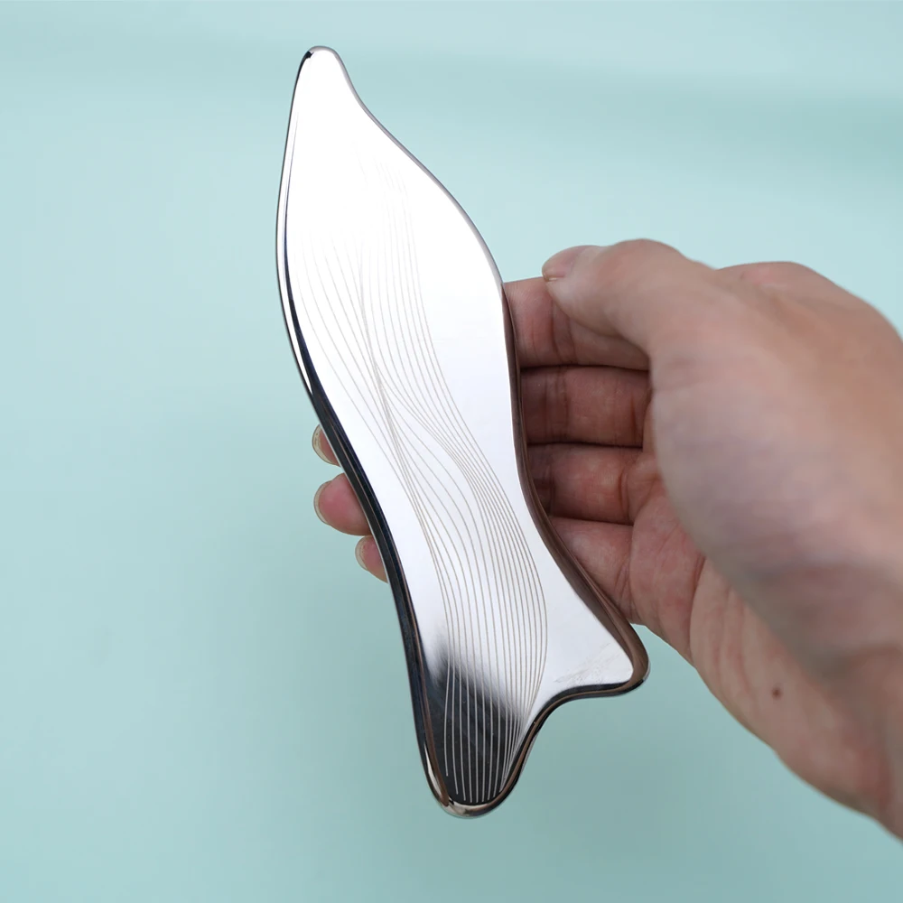 A Silver Orchid-Shaped Stainless Steel Scraping Board - A Body Massage Tool