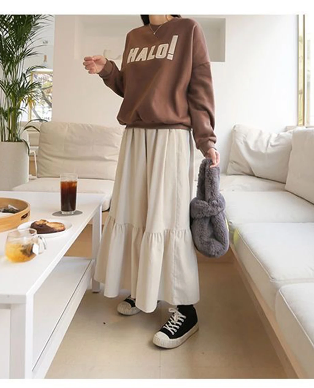 The loose, student-style, retro autumn corduroy fashion A-line all-in-one mid-calf apricot aesthetic skirt from Harajuku