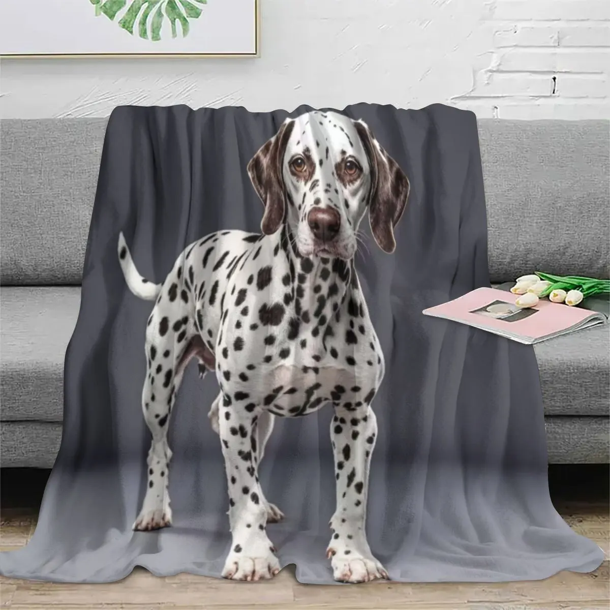 A soft charcoal grey flannel fleece throw blanket with a realistic high-definition portrait print of a spotted Dalmatian dog.