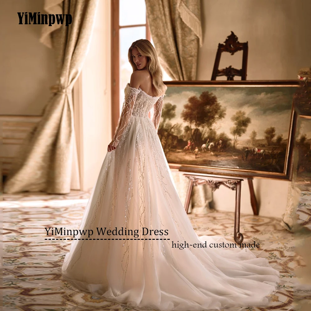 Abiti da sposa con perline personalizzati 2025 Abito da sposa di lusso a maniche lunghe con scollo a cuore senza schienale Abito da sposa principessa A-Line in tulleAbiti da sposa personalizzati a perline 2025 lusso ma