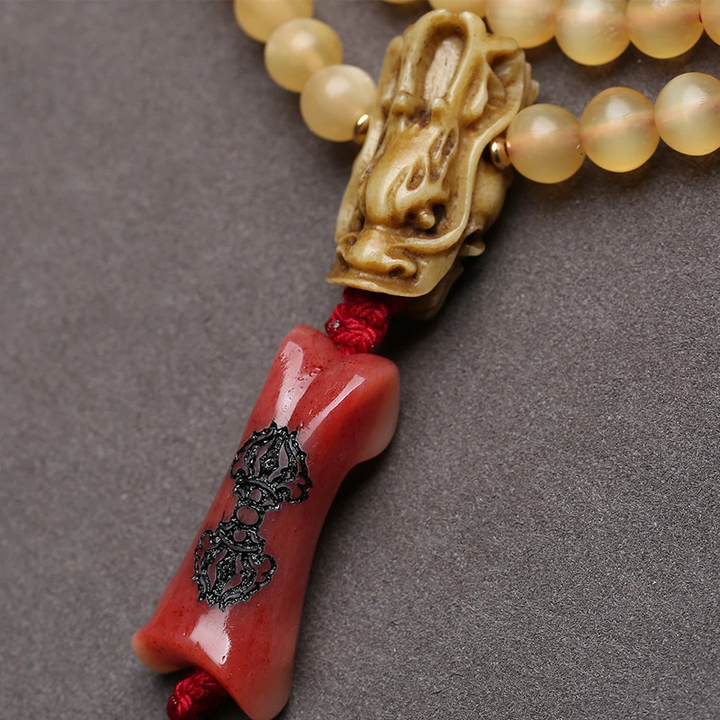 108-bead Buddhist bracelet made of ram's horn agate, with bone accessories and neck pendant