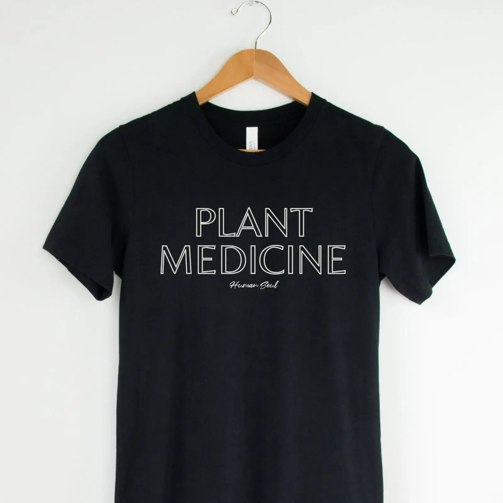 May include Black t shirt with white text that reads PLANT MEDICINE and Human Soul in a smaller font below vintage Washed