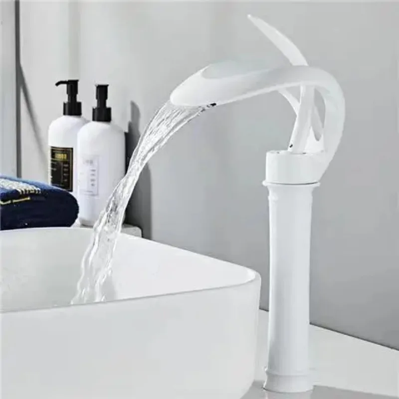 

White waterfall faucet hot and cold face washbasin sink on the sink on the bathroom toilet