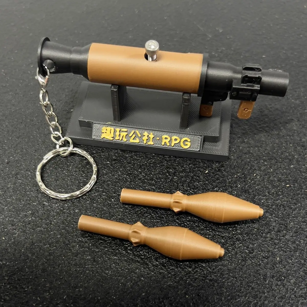 

Arena Breakout RPG-7 3D Printed Mini Finger Launcher Gun, Hot Selling New Viral Keychain Trendy Backpack Pendant Gift for Gamers