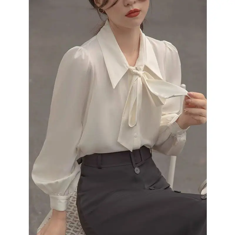 Fashion Lapel Button Spliced Loose Lace Up Bow Shirt Women\'s Clothing 2023 Spring New Casual Tops Solid Color Office Lady Blouse