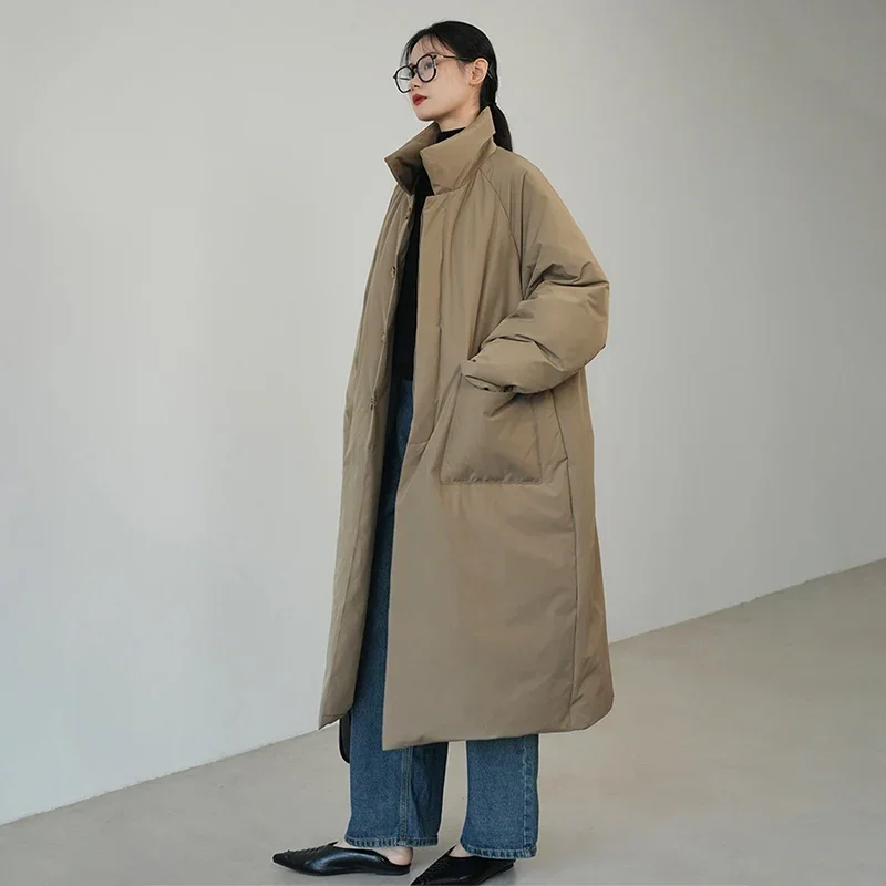 2025年冬 ロング丈 中綿コート レディース トレンド オーバーサイズ ゆったり スタンドカラー パーカー 女性らしい気質 ボタン付き 大きめポケット ジャケット