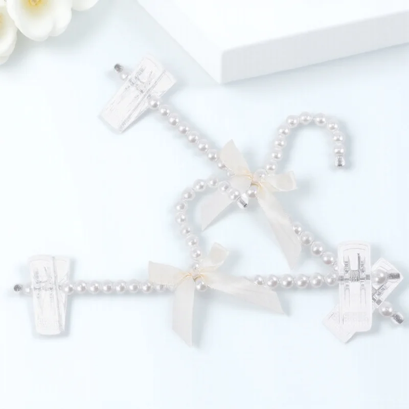 

2Pcs Creative Pearl Clothes Hangers with Bowknot Design Strong Bearing Capacity Non-Slip Pant Hanger for Jackets Sweaters Skirts