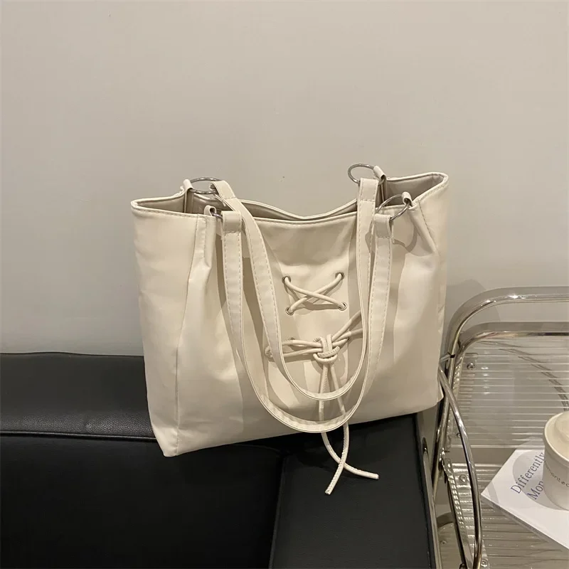 Stylish, simple and large-capacity shoulder bag, soft-faced lace-up bow handbag.