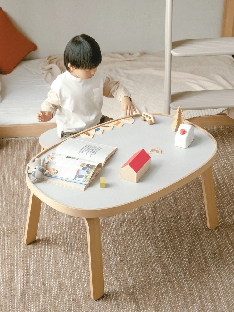 A few tables children's play table small stool oval coffee table living room modern and simple