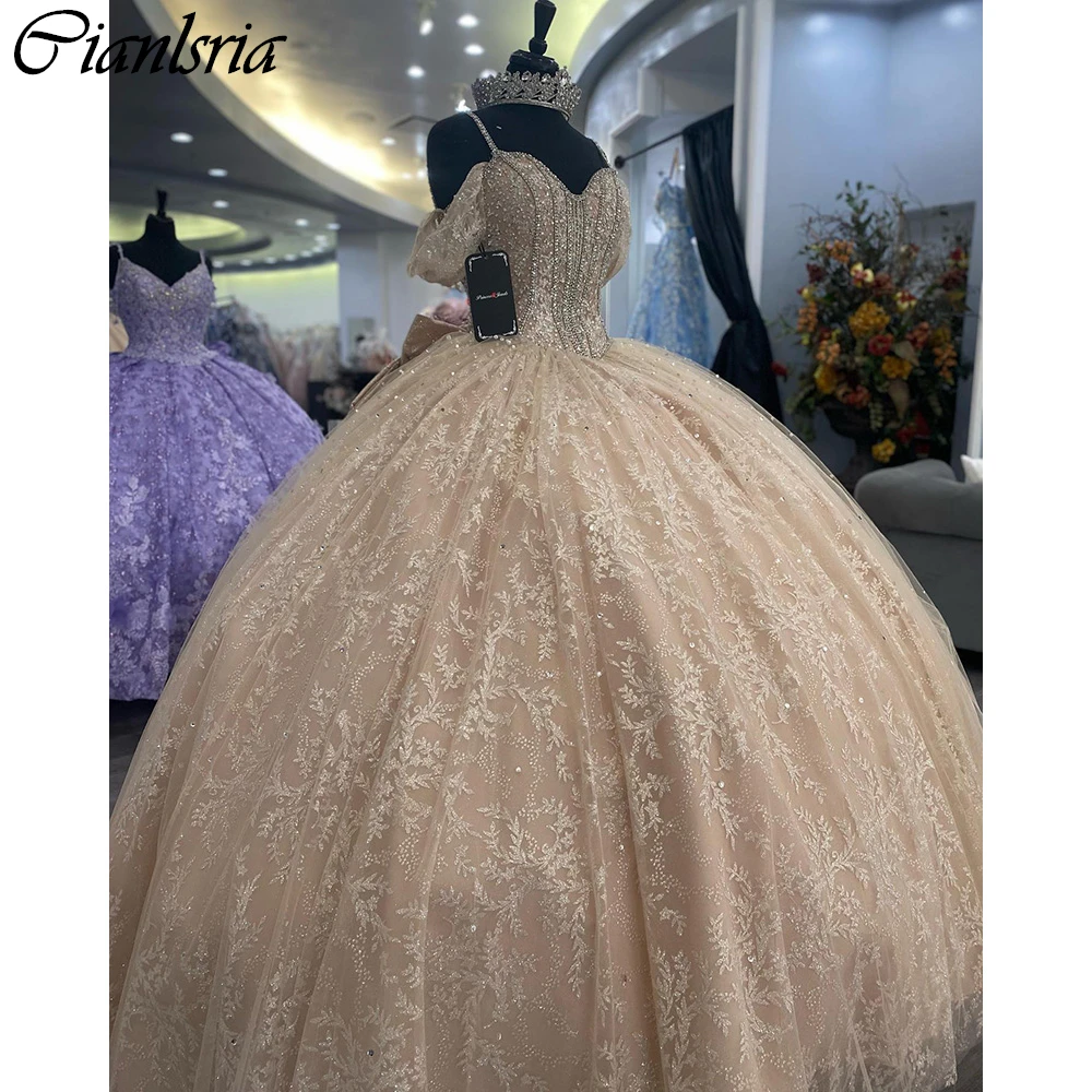 

Champagne Spaghetti Strap Beading Crystal Ball Gown Quinceanera Dresses Sequined Lace Bow Corset Vestidos De 15 Años