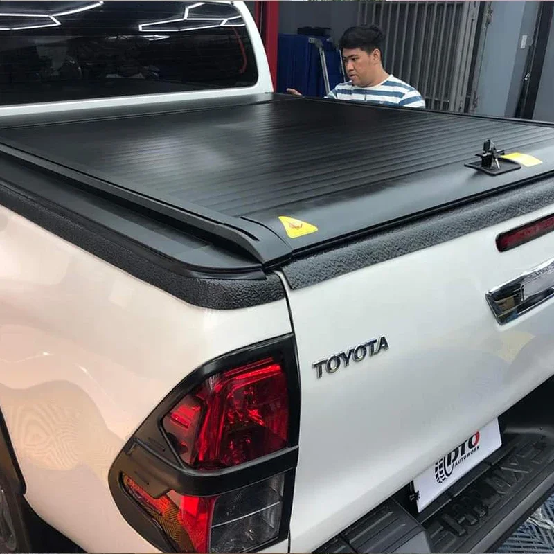 Pickup truck car accessories retractable truck bed covers roller lid tonneau cover for hilux rocco revo vigo gun125