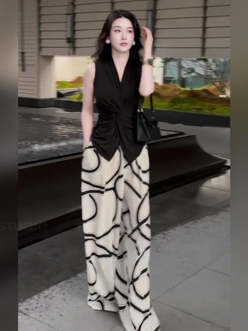 

Новый летний комплект из 2 предметов для женщин, тонкий черный топ без рукавов + широкие брюки с высокой талией и геометрическим узором, элегантный повседневный наряд