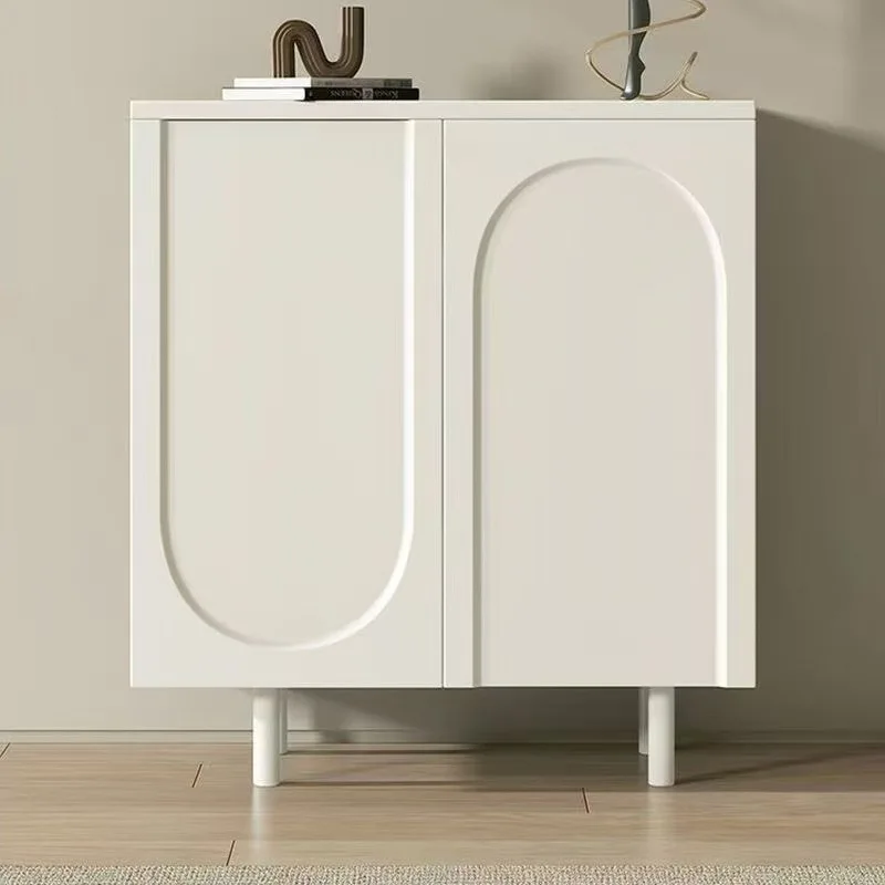 

At the door of the shoe cabinet, the home is against wall, and new cream integrated shoe rack is stored in locker.