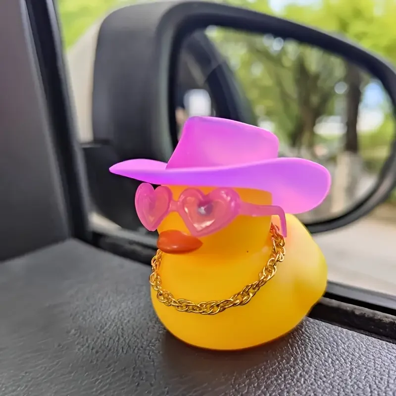 A fashionable rubber duck car dashboard ornament with pink denim hat and heart-shaped glasses decoration accessories