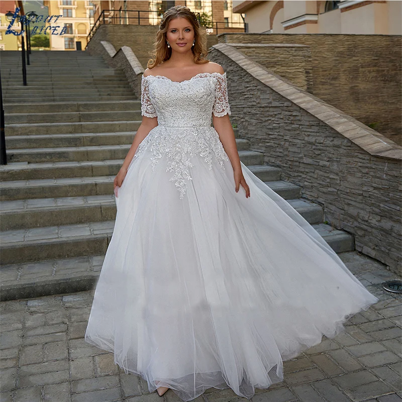 LAYOUT NICEB eleganti abiti da sposa Boho maniche corte con spalle scoperte in pizzo Applique abiti da sposa scollo a barca Plus Size Tulle muslimah Abito da sposa in stile bohémien Abito da sposa a maniche corte. Gran