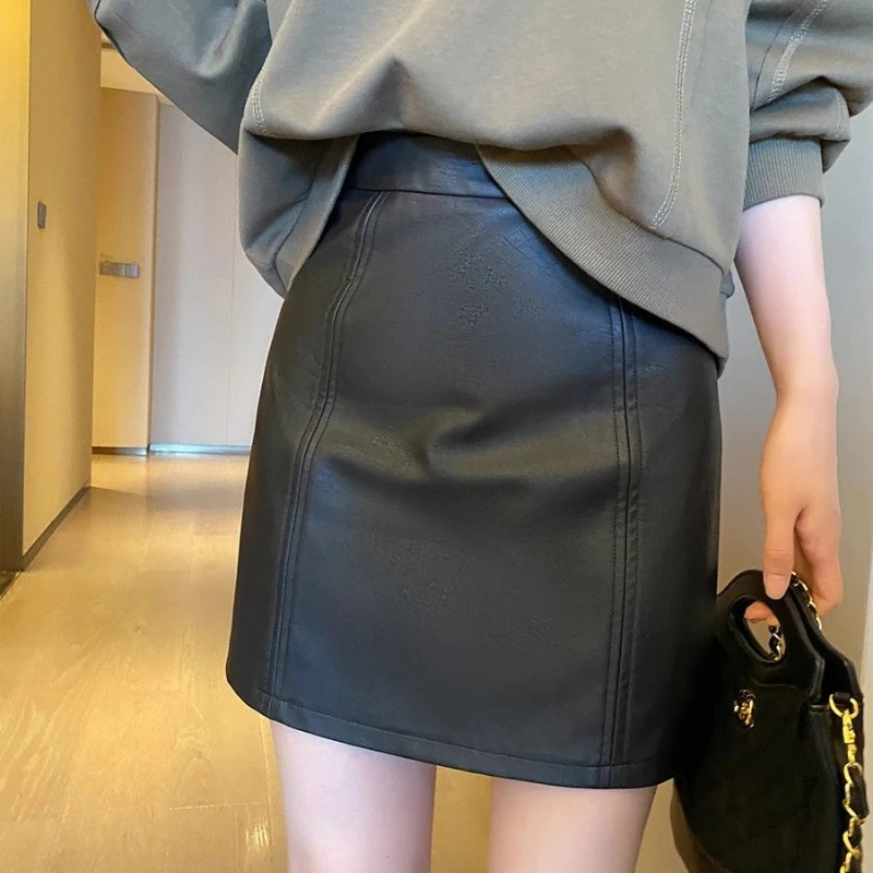 البساطة مكتب سيدة الخريف الشتاء المرأة الصلبة سستة الكورية موضة عالية الخصر قصيرة ضئيلة ألف خط بولي Leather الجلود الورك تنّورة ملفوفة