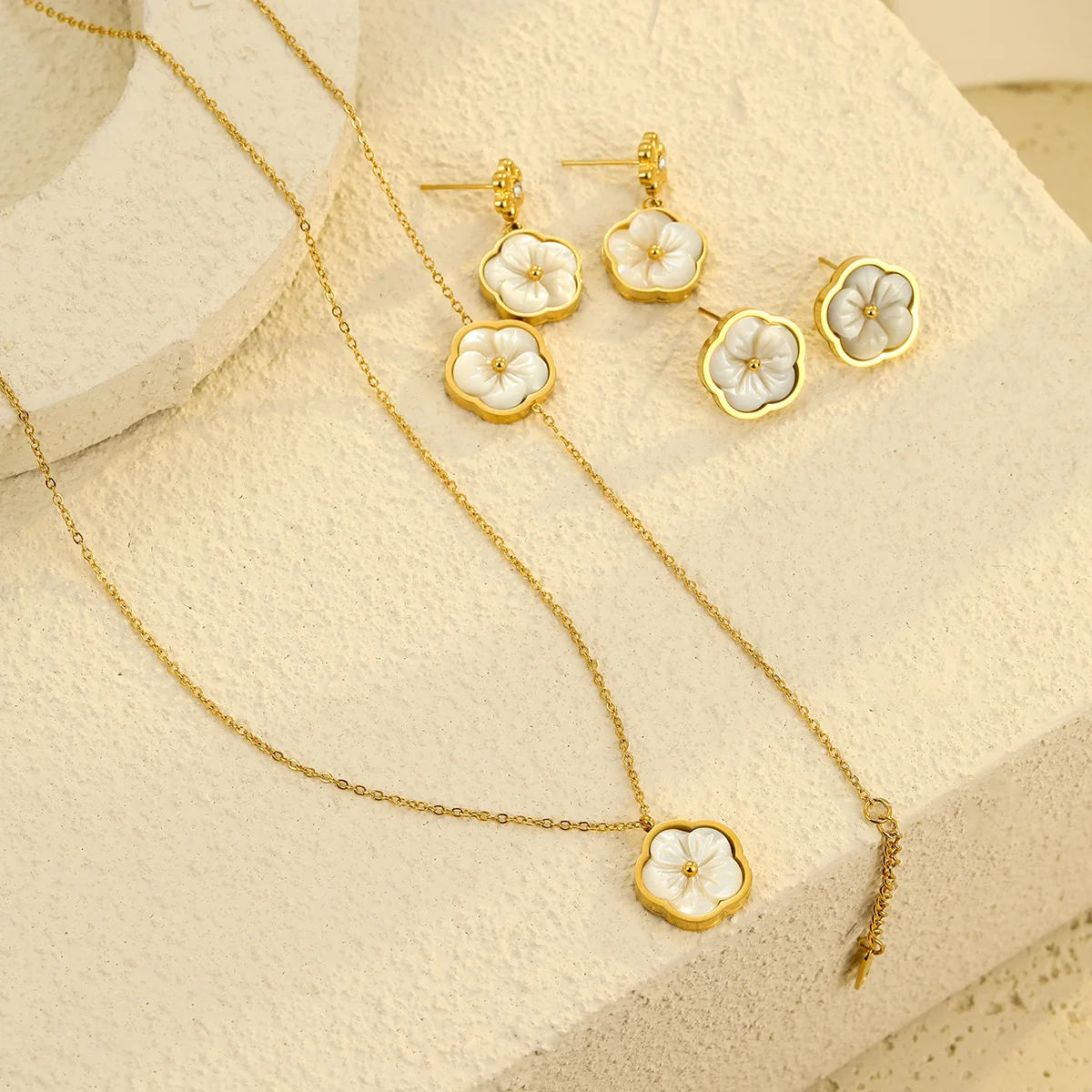 New light luxury high-end stainless steel earrings, zircon flower inlaid fritillary petals, pendant, women's necklace, bracelet.