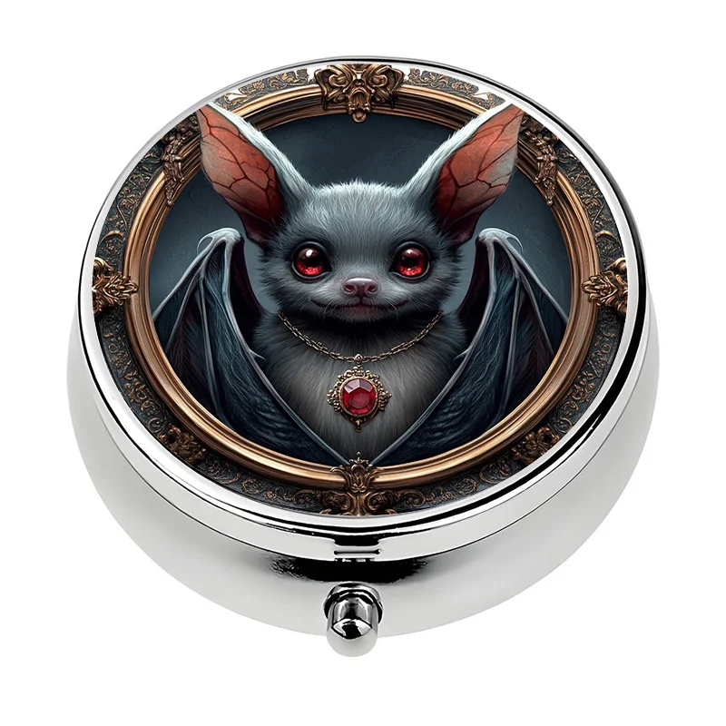 A small pill box with a three-compartment design, featuring a Halloween bat theme, is perfect for organizing vitamins in a purse or handbag. It is an ideal and unique gift choice