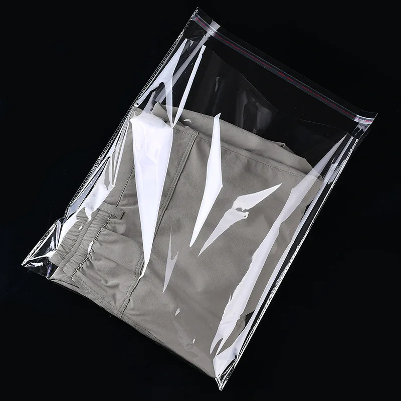 StoBag 100 Pieces Clear Apparel Bags Self Seal Plastic Bags Wedding Party Opp Gift Bag Adhesive Bags for T-Shirt and Clothes