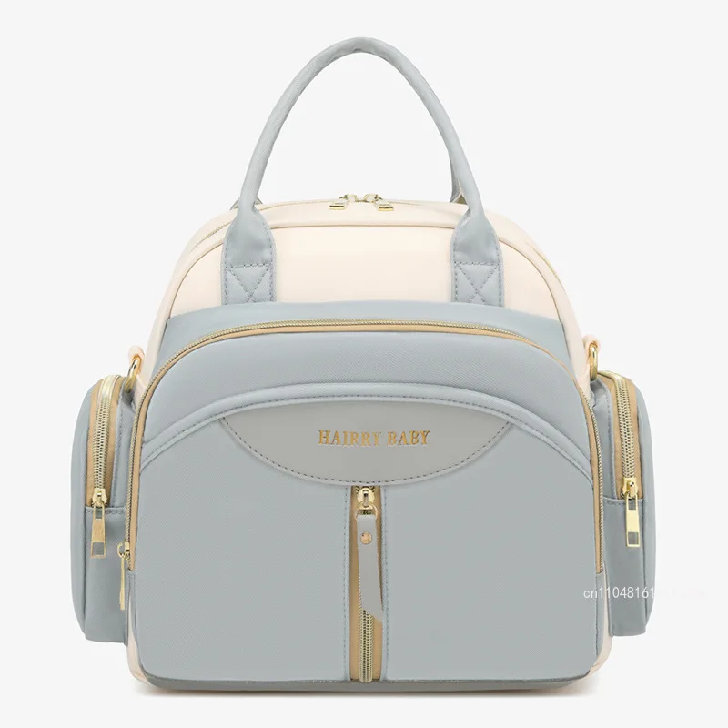 2026 New Fashionable Mom Bag Lightweight, Compact, Multi Functional Mother and Child Outward Backpack Mom Bag Handheld Baby Bag