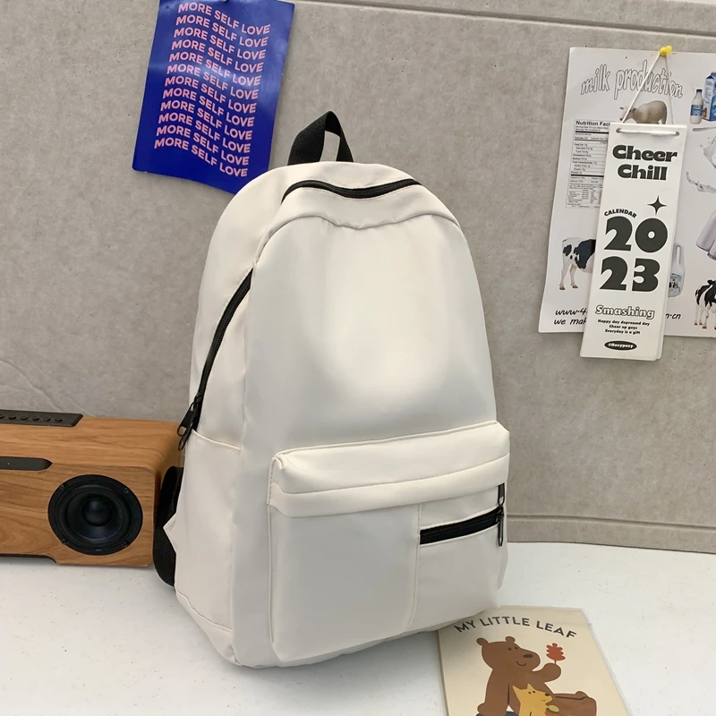 シンプルなソリッドカラーのカジュアルバックパック、軽量で多用途な高校生バッグ、ハンギングアウト用の多用途なソリッドカラーのデイパック