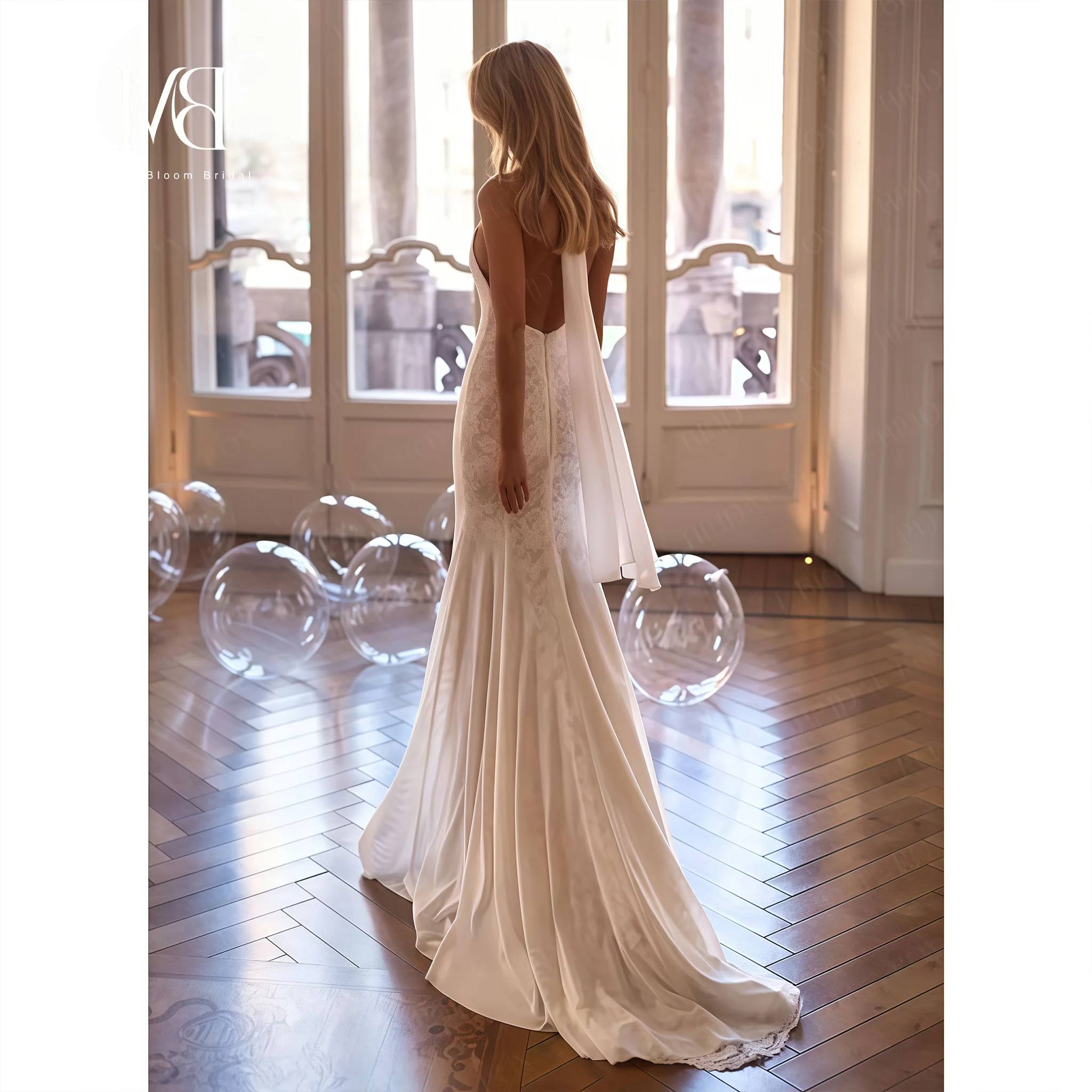 Ivory halter-neck strapless sleeveless mermaid gown for formal occasions and proms featuring a printed design and open back