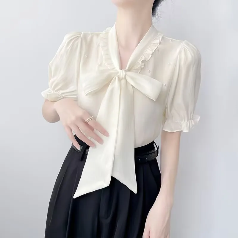 Verano moda coreana arco cordones bordado bengalas camisas 2025 nueva manga corta con cuello en V todo-fósforo volantes blusa mujeres Tops