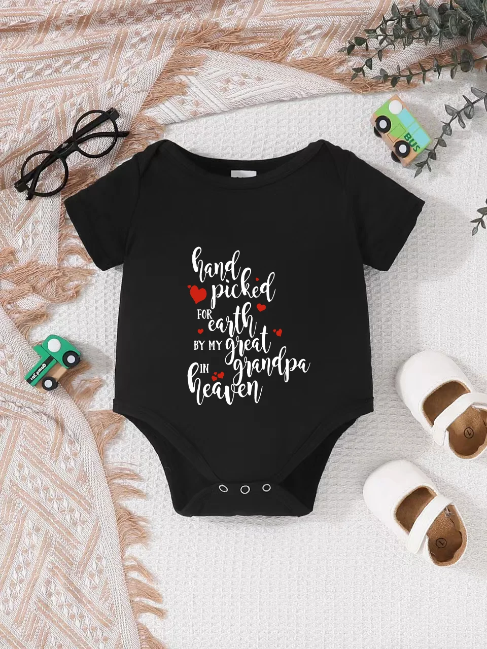 Playful letter-printed baby short-sleeve triangle bodysuit. Button closure for easy dressing