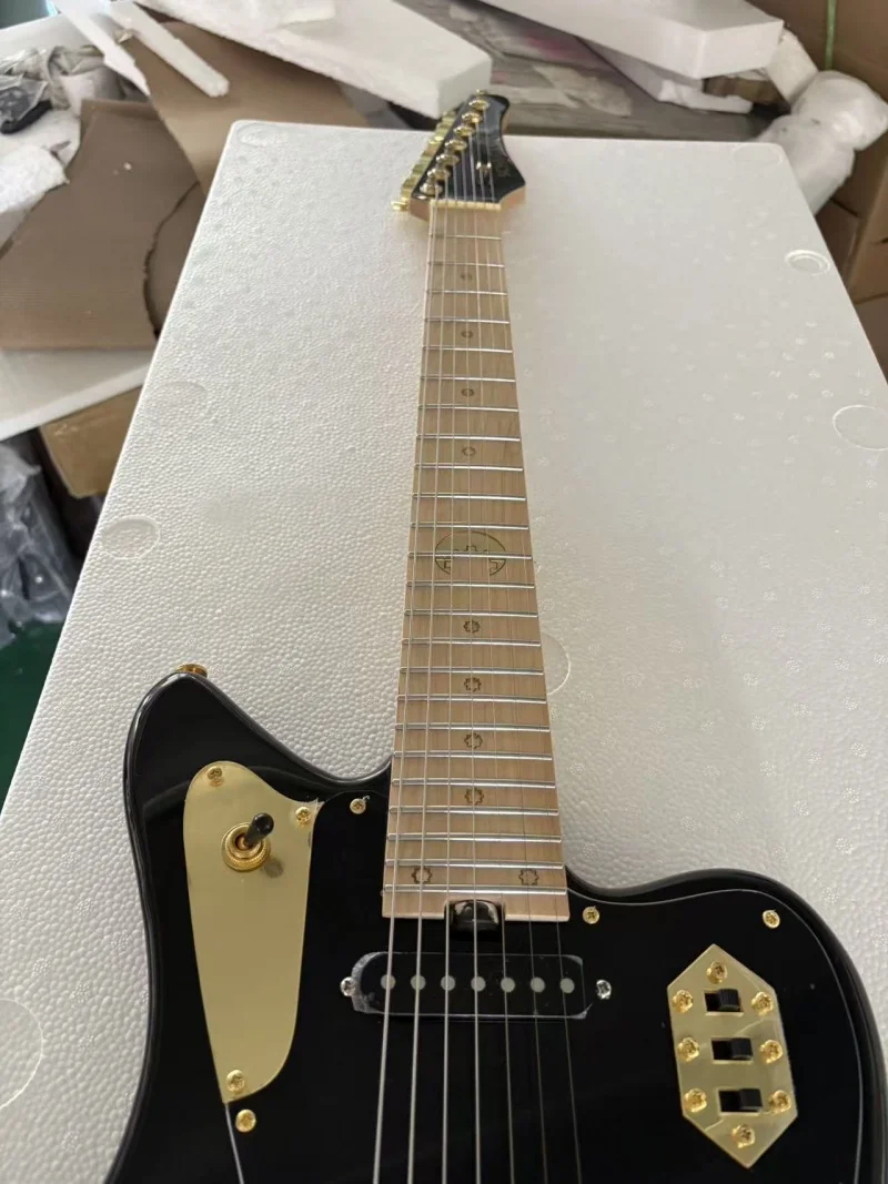 Black 7-string electric guitar, with high gloss finish, fixed bridge, customizable, free delivery