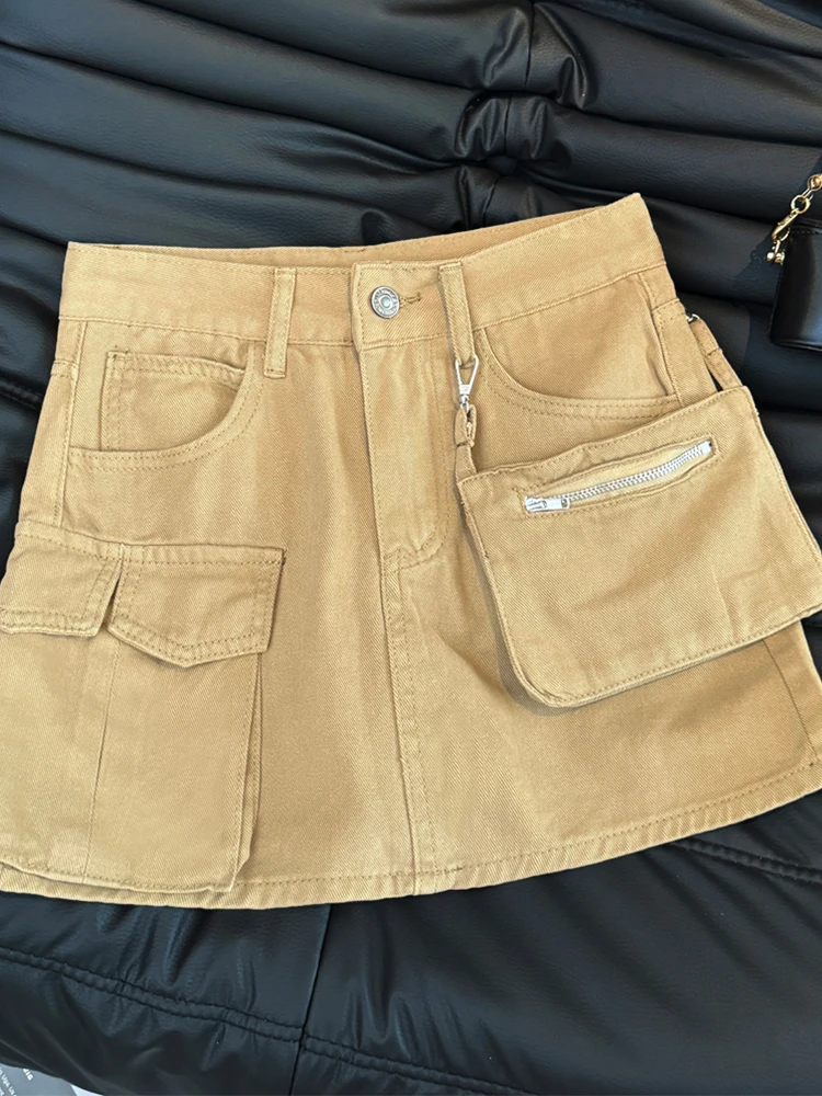 Amerikanisches Retro-Arbeitskleidungs-Taschendesign, würziges Mädchen, sexy, hoch taillierter A-Linien-Denim-Halbrock, Y2K-Damen, Sommer 2025,