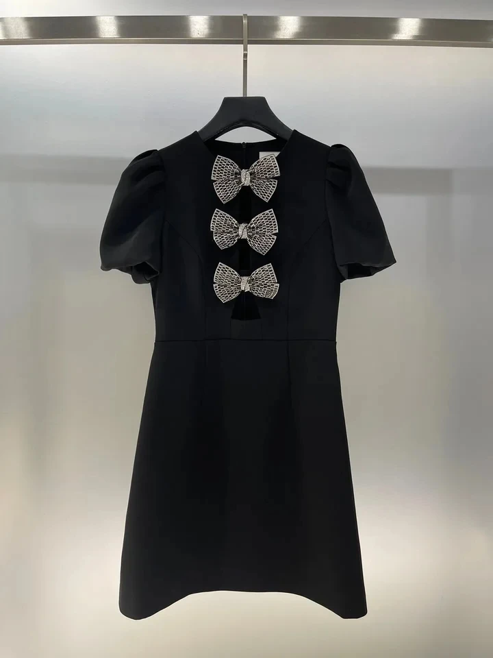 

2024 Early Spring New Black Hollow Fashion Bubble Sleeves Metal Bow A-line Midi Dress woman skirt