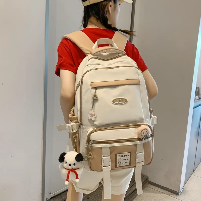 Mochila escolar para estudiantes de escuela primaria, Color de contraste, alivio de carga versátil, nueva