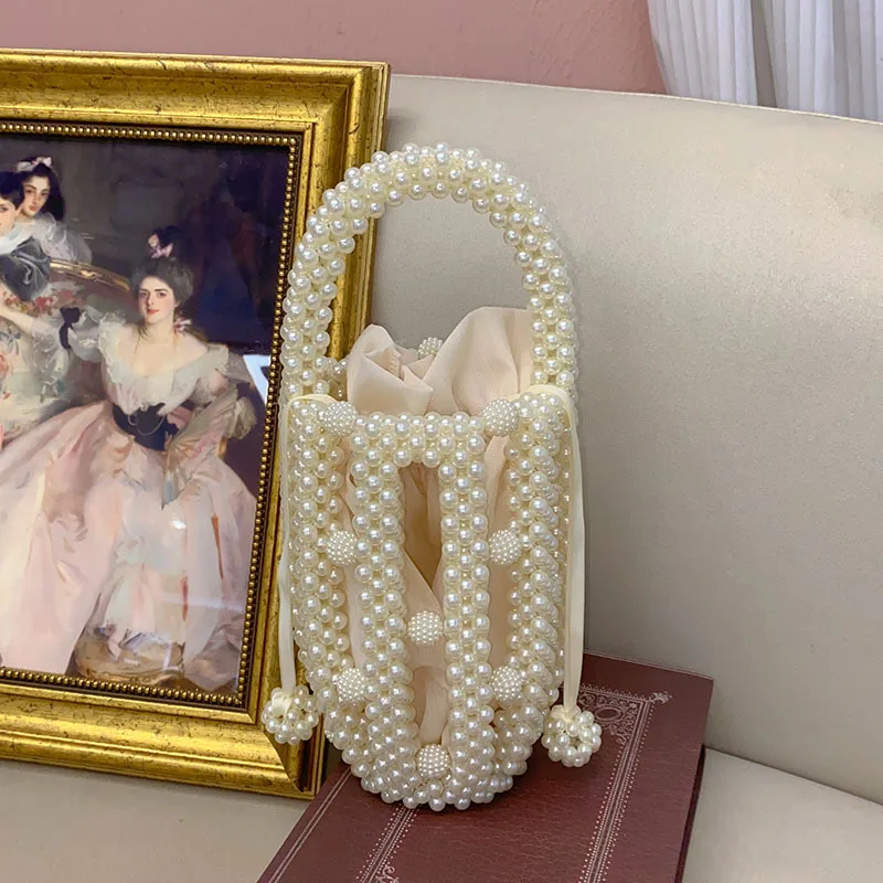 

French romantic fashionable hand-woven beaded bucket bag celebrity sweet casual hollow portable dinner bag