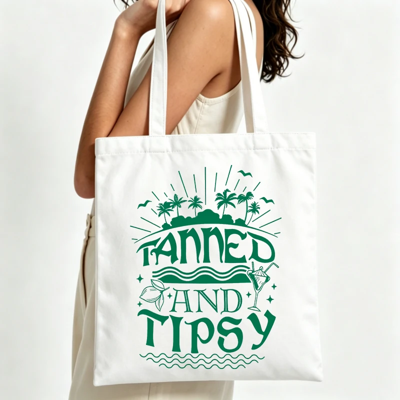 palm tree and cocktail graphic canvas tote bag with typography print, ideal for summer beach outings and casual shopping