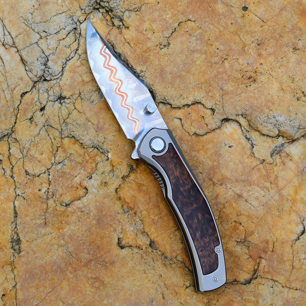 High carbon steel folding outdoor knife with copper-inlaid craftsmanship and solid wood handle, suitable for camping and gifting