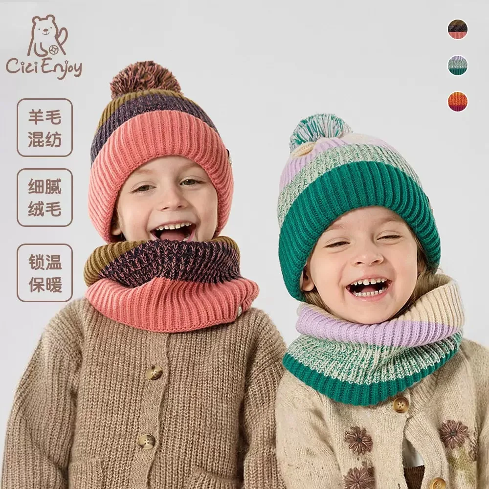 

A three-piece winter children's hat, gloves and scarf set with fleece for warmth. A girl's fur balls in contrasting colors