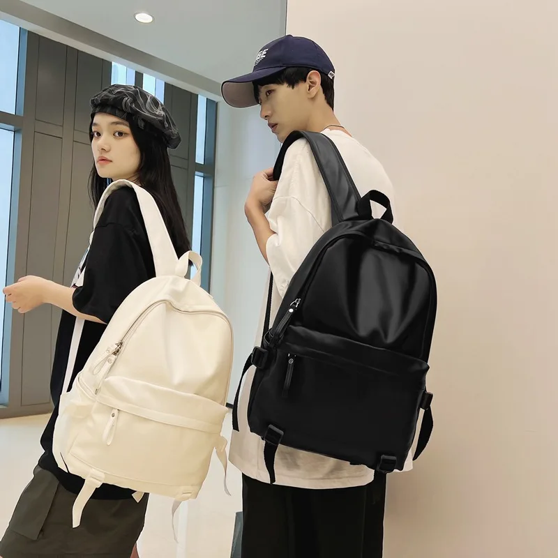 Mochila de piel sintética para hombre y mujer, bolso de viaje de gran capacidad, diseño clásico, color blanco y negro