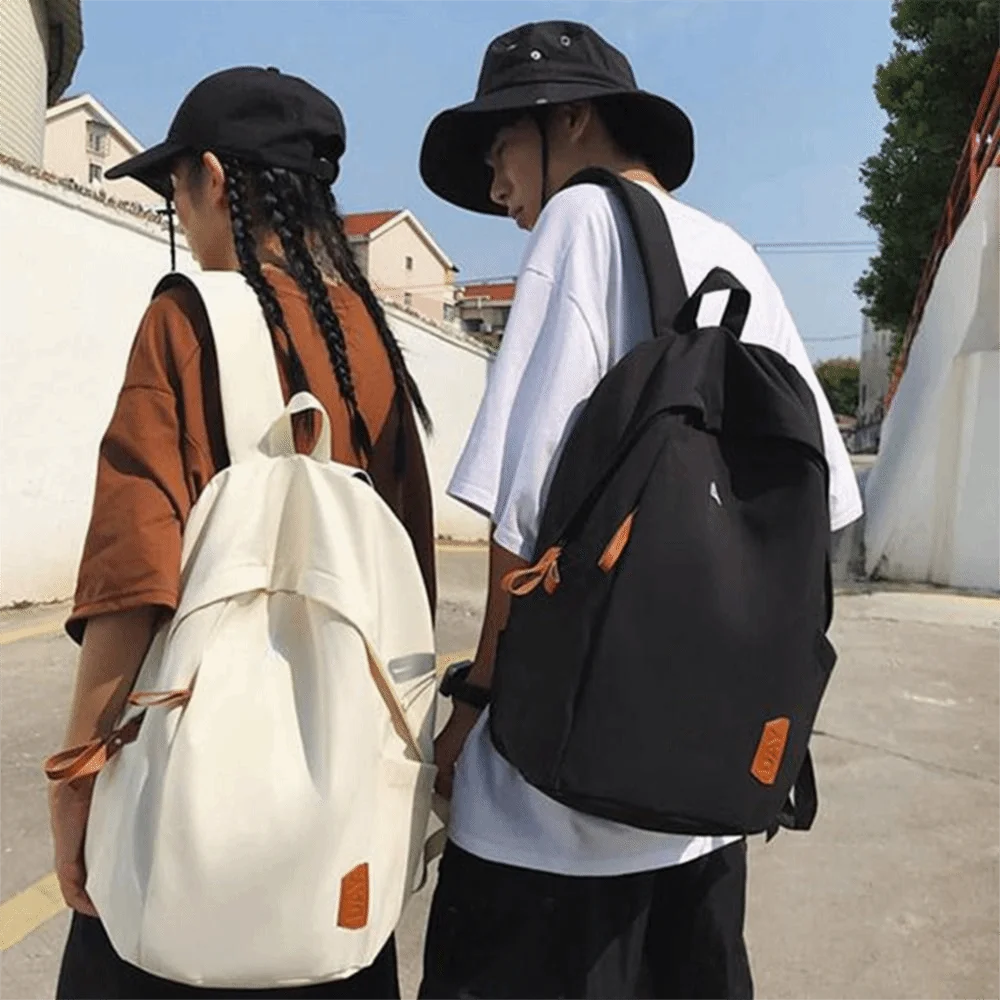 حقيبة ظهر جامعية من القماش متعددة الاستخدامات بلون سادة مقاومة للماء للسفر حقيبة كتف ذات سعة كبيرة للمشي لمسافات طويلة