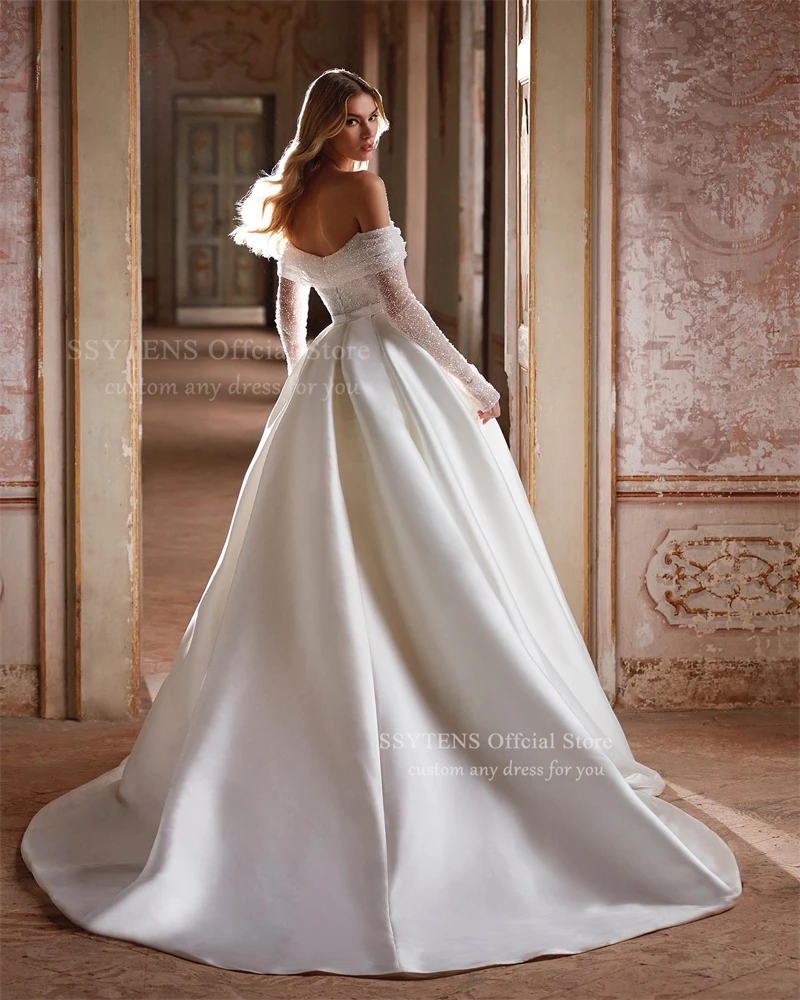 فساتين زفاف SSYTENS الأميرة الساتان للمرأة بأكمام طويلة 2025 فساتين العروس الخرز قبالة الكتف Vestidos De Novia مخصصة