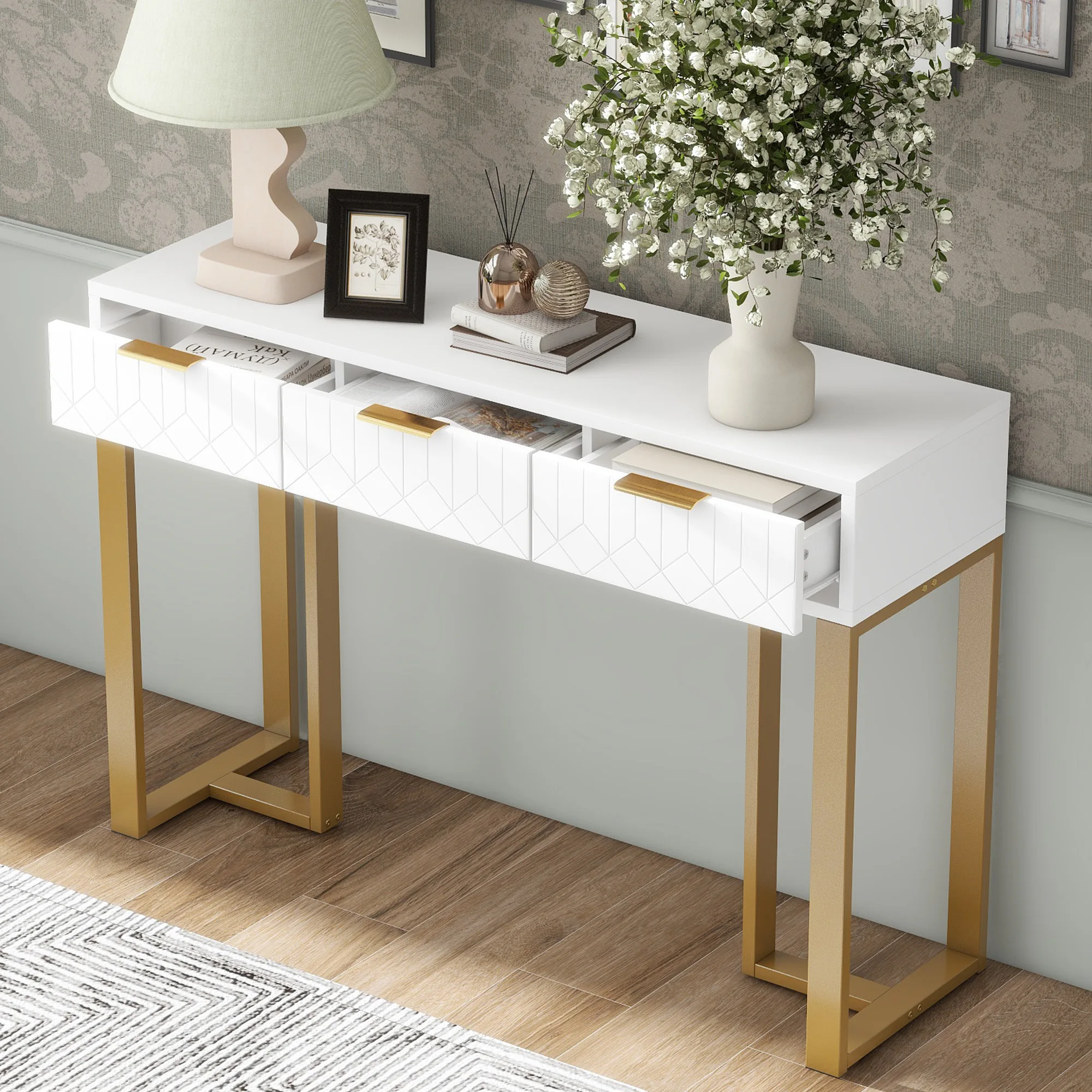 Modern console table with drawers, gold-colored frame, adjustable foot pads and elegant handles