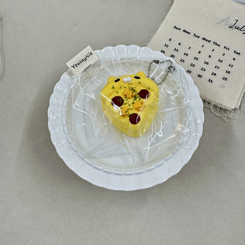 A handmade kitten-shaped pizza squishy—cute, stress-relieving, and perfect for carrying with you.