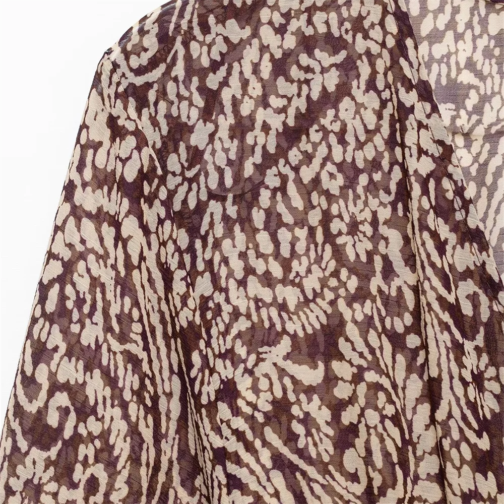 PB&ZA's new women's dress features a V-neck, long puff sleeves, knot details and paisley pattern for a vintage look