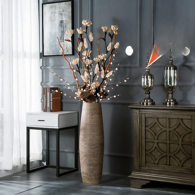 Floor to ceiling large ceramic vase, living room, TV cabinet next to modern and simple dry flower arrangement, high size decora