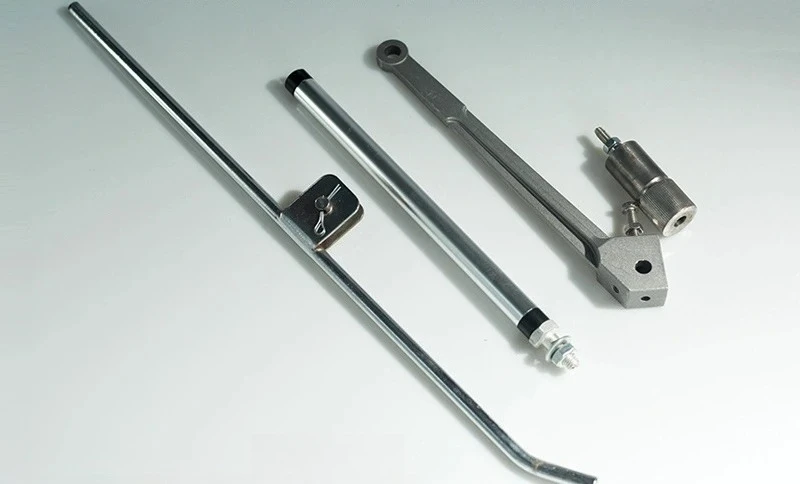 Paver leveler, swing arm, slide bar, sliding shoe, rocker arm