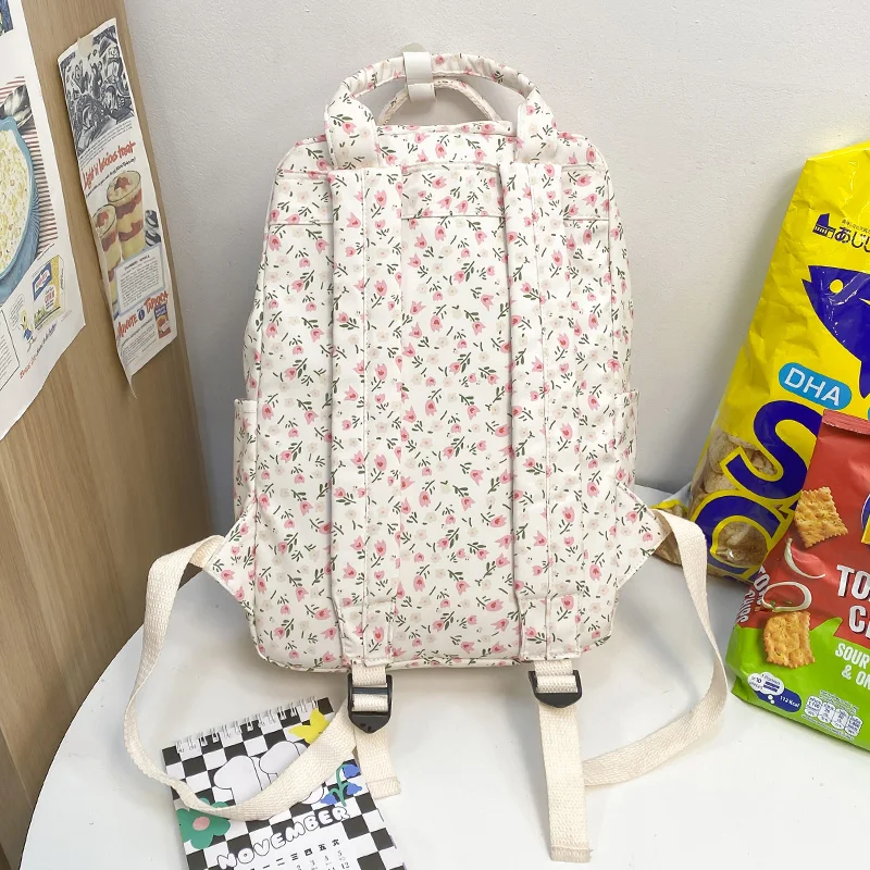 Mochila bonita con estampado Floral para mujer, morral escolar con estampado Kawaii para ordenador portátil o universidad, a la moda