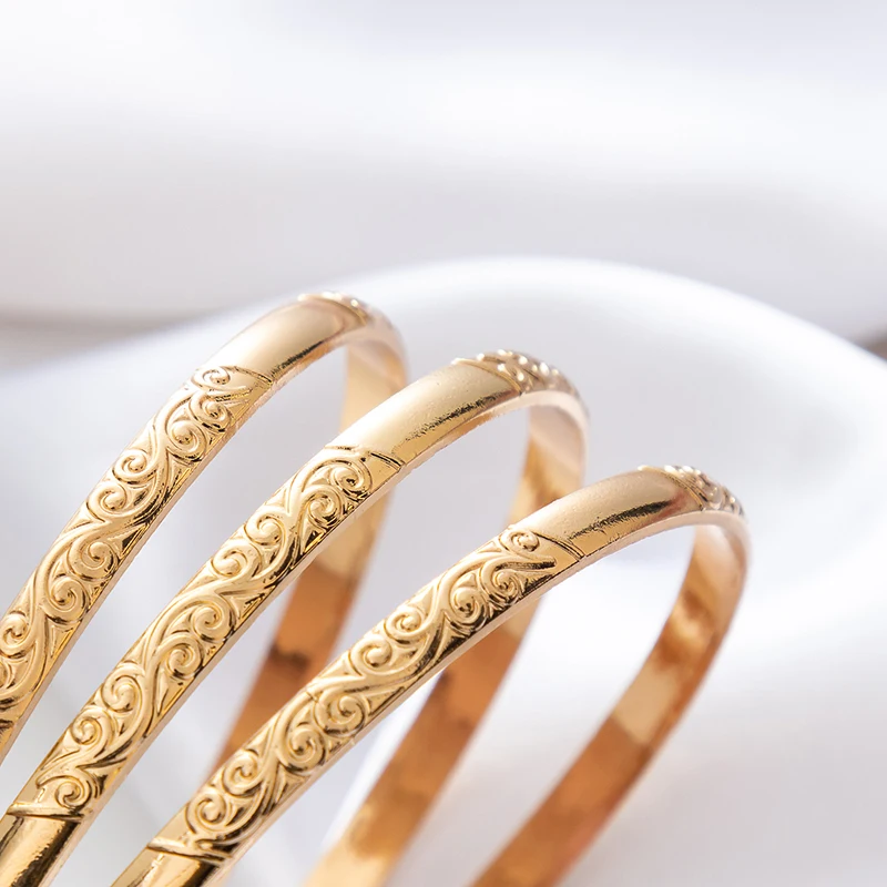 Classic Golden Tone Engraved Bangle, Simple Thin Design with Intricate Carving, Timeless Bracelet for Women