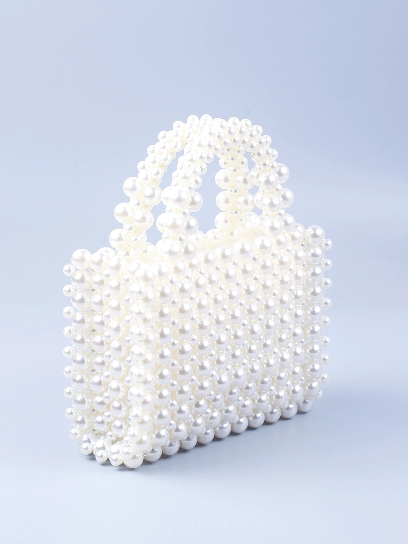 Small and high-end texture pearl hand-held woven pearl small square bag banquet bag, fashionable and versatile